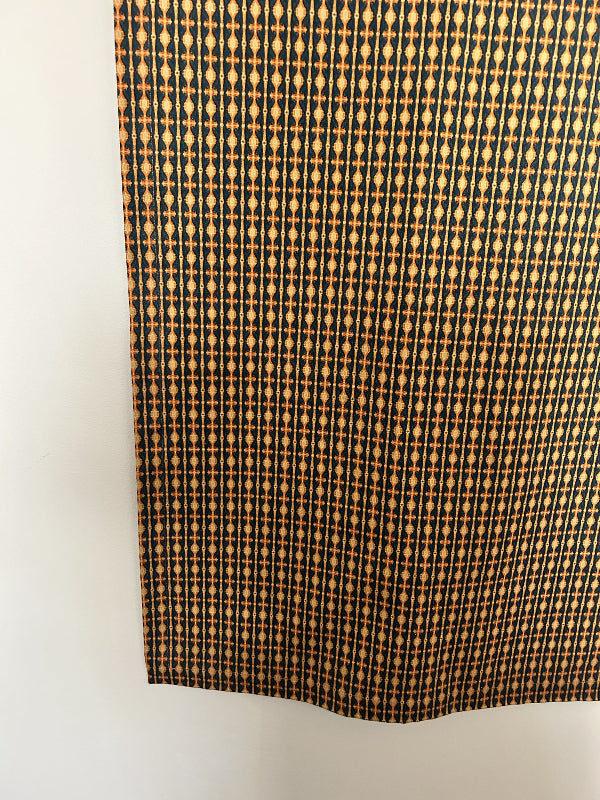 Star Gazing Tablecloth in orange and black, a curated, sustainable, and premium design made from durable cotton and hemp. Timeless elegance with quality craftsmanship.