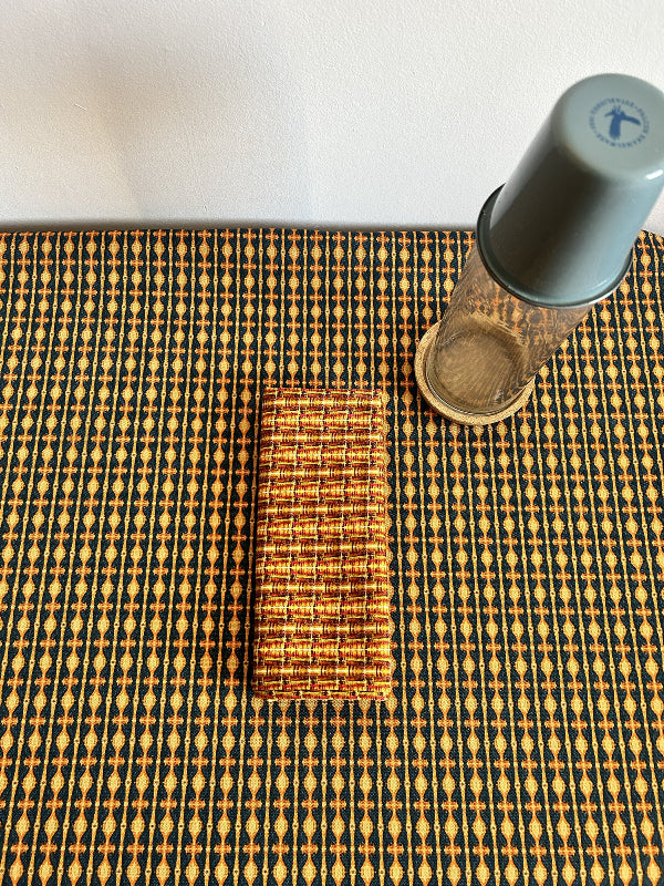 Star Gazing Tablecloth in orange and black, a curated, sustainable, and premium design made from durable cotton and hemp. Timeless elegance with quality craftsmanship.