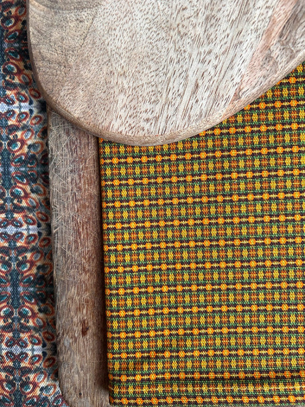 Luxury Pure Sun Tea Towel, handmade in the UK, showcasing a bold brown and orange design on durable, eco-friendly 309gsm organic cotton.
