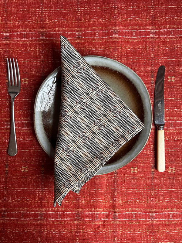 Premium Lines Cotton Napkins, featuring timeless black and white patterns, handmade in the UK and packaged plastic-free for sustainable elegance.