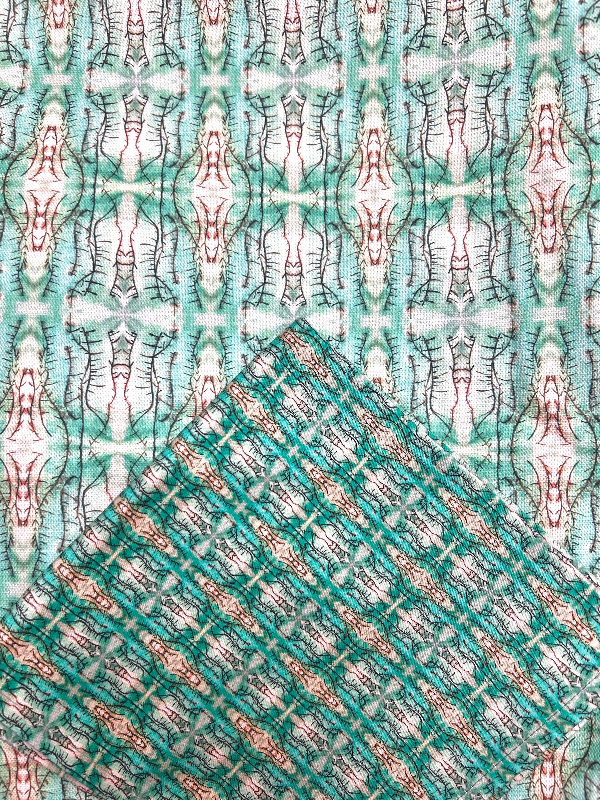 Green Blossoms Cotton Napkins, artist-designed and handmade in the UK. Vibrant green and white napkin prints on 100% cotton fabric, 43x43 cm napkins. Eco-friendly packaging, machine washable, and perfect for everyday use or special occasions. timeless premium napkins