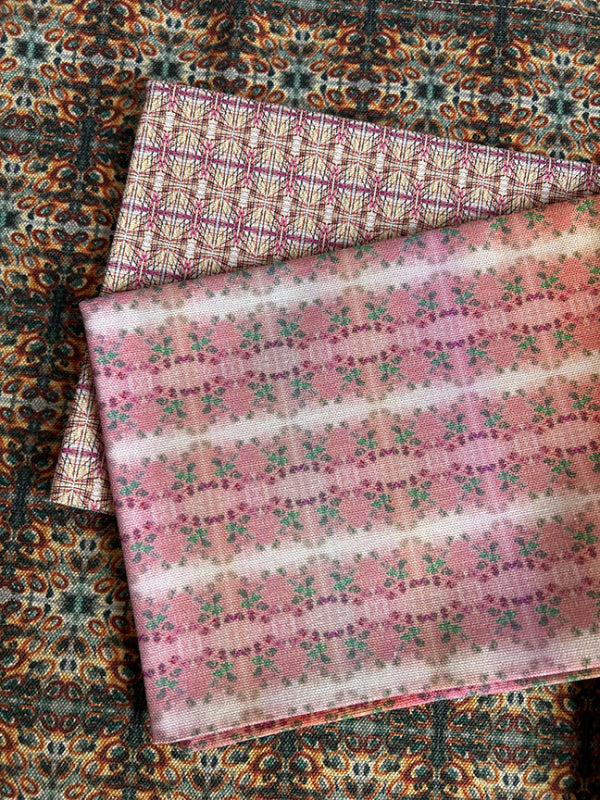 Artist-designed Light Cotton Tea Towel set, showcasing pink, blue, and yellow shades, sustainably crafted, machine washable, and rolled plastic-free in the UK.