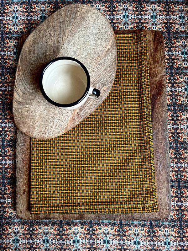 Pure Sun Tea Towel with vibrant brown and orange hues, artist-designed and sustainably made from premium, organically sourced cotton.