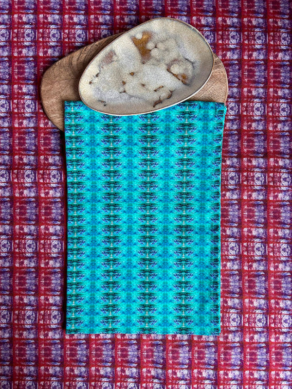 Sea and Sky Tea Towel in turquoise, a curated and sustainable design crafted from premium organic cotton. Timeless, vibrant, and of exceptional quality.