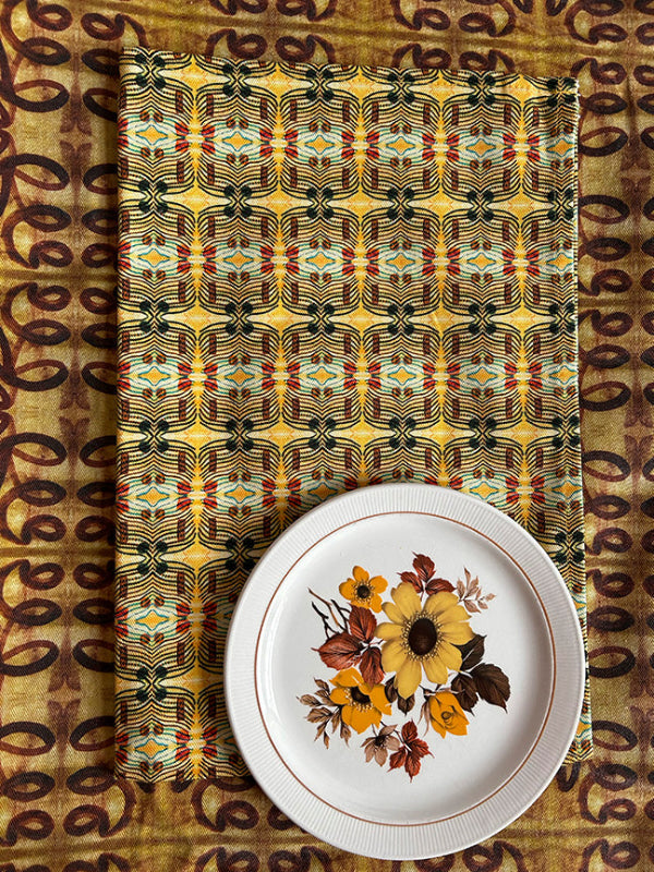Many Suns Tea Towel, featuring a bold yellow print, digitally printed on organic cotton for a premium and considered kitchen accessory.
