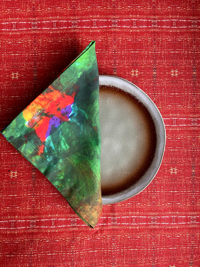 Happy Seasons Cotton Napkins featuring vibrant multicoloured patterns, artist-designed and handmade from 100% cotton in the UK.