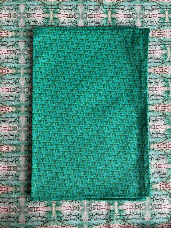 Curated Wave Surfing Tea Towel in green, artist-designed and sustainably crafted from premium organic cotton. Timeless, vibrant, and of exceptional quality.
