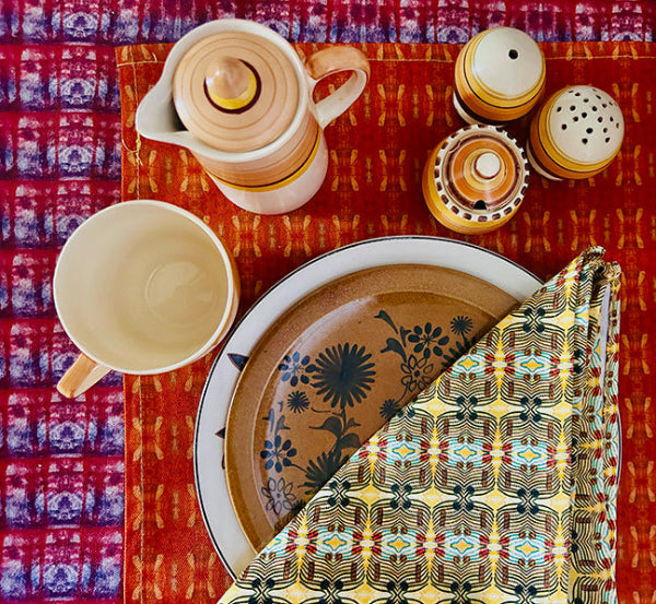 Sustainable Many Suns Cotton Napkins, crafted from durable cotton, ideal for daily use or special occasions, packaged plastic-free with a paper belly band.
