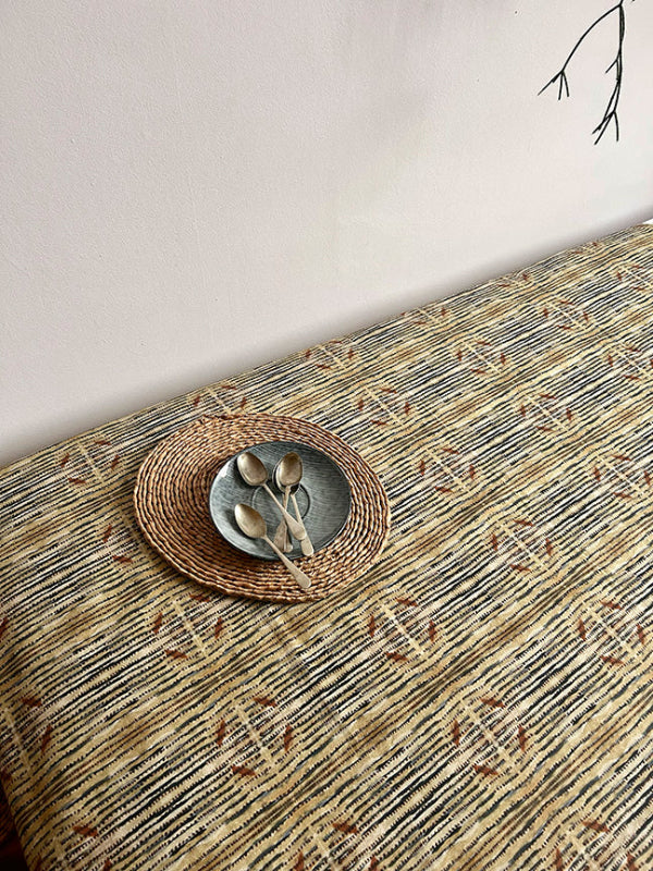 Sustainable Lines Cotton and Linen Tablecloth, offering a harmonious blend of style and durability, perfect for casual dining or celebratory gatherings.