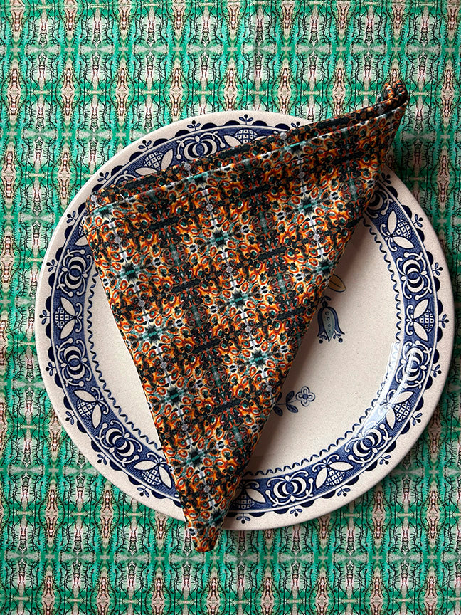 Hedgerow Cotton Napkins in blue, showcasing vibrant artist-designed patterns on soft, 100% cotton fabric, perfect for stylish and sustainable dining.