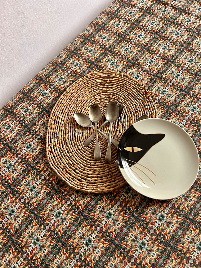 Hedgerow Cotton and Linen Tablecloth in blue, showcasing artist-designed patterns on unbleached natural fabric, perfect for 2-8 person dining tables.