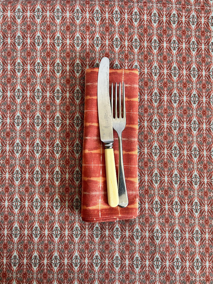 Sweet Connections Tablecloth, artist-designed in red and blue. Premium, sustainable, and timeless, crafted from quality OEKO-TEX linen-cotton blend.