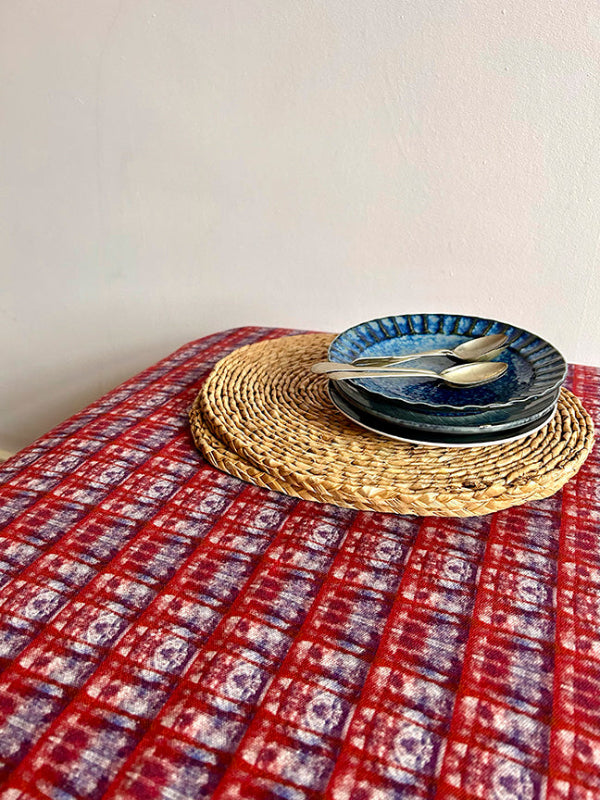 Artist-designed Lavender in the Sun tablecloth with purple and red hues, crafted from eco-friendly cotton-hemp blend, rolled plastic-free for mindful dining.